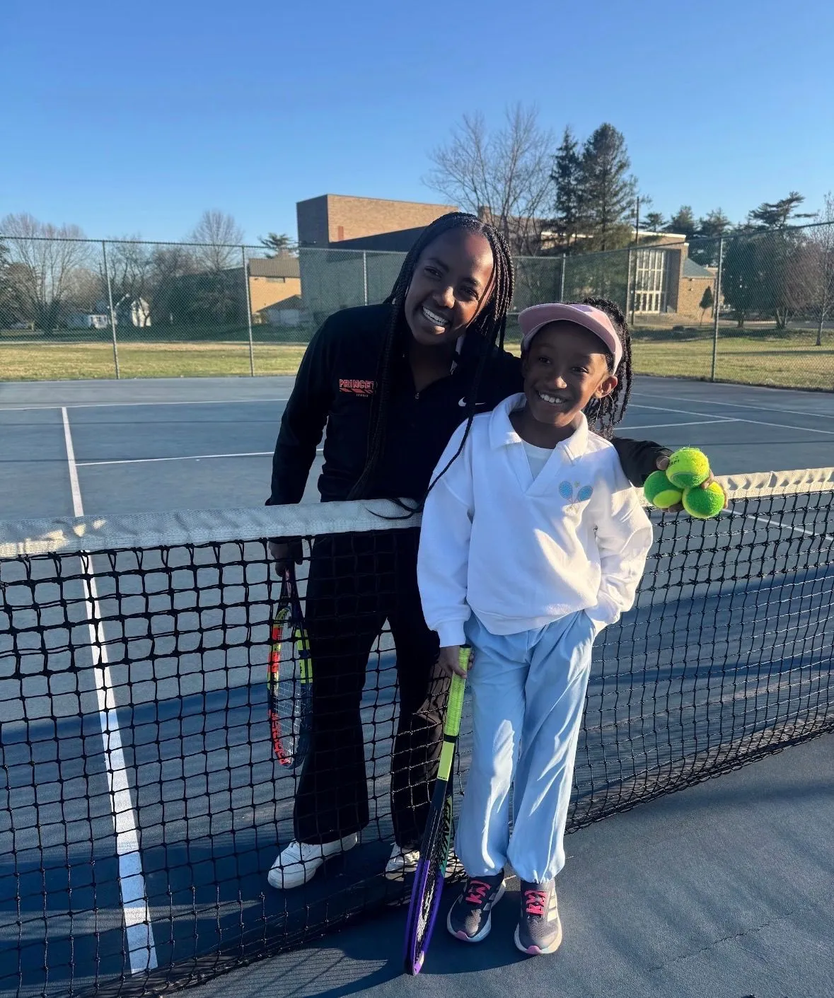 Princeton University women’s tennis athlete Tsehay Driscoll with a young participant